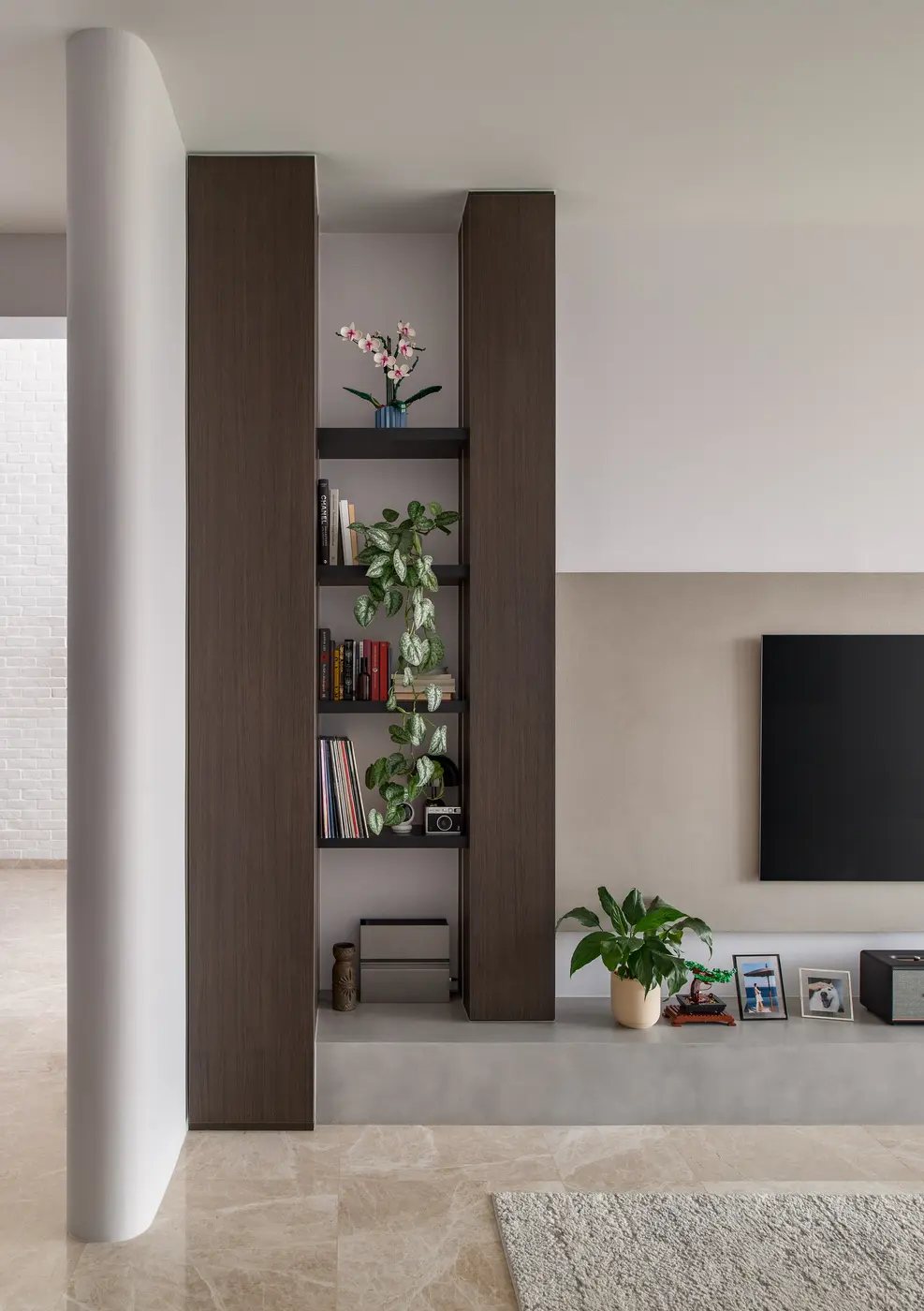 Living room with shelving and TV wall