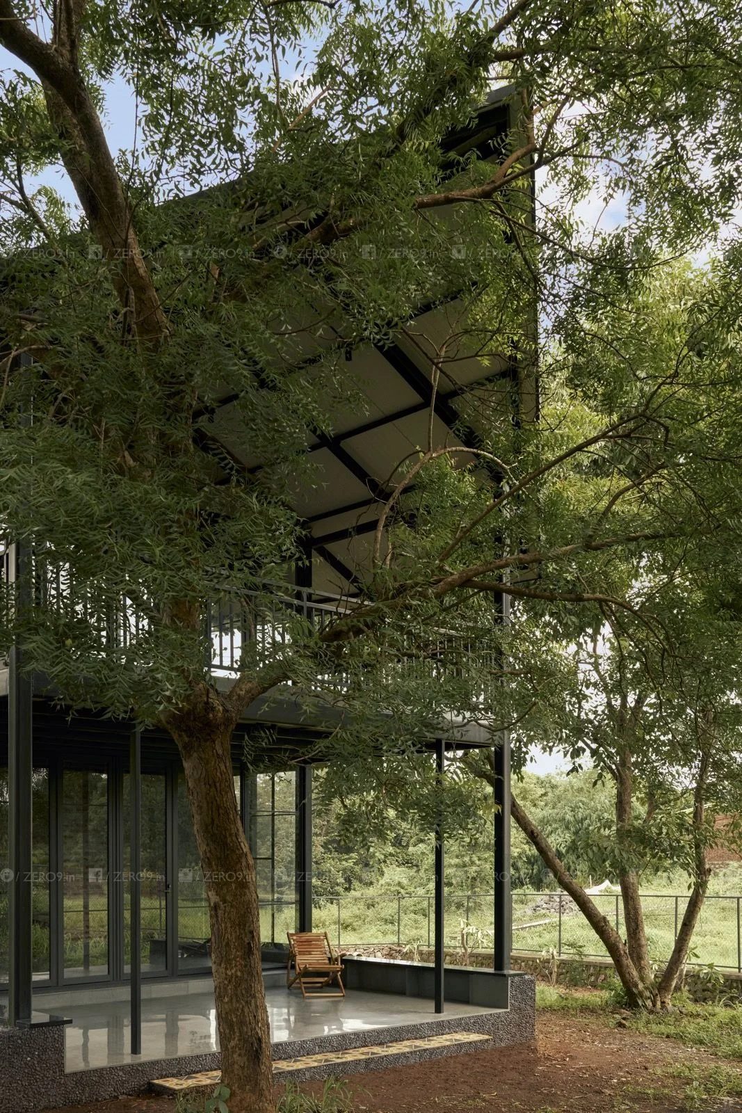 Verandah — threshold between forest and interior, natural light and brick detail